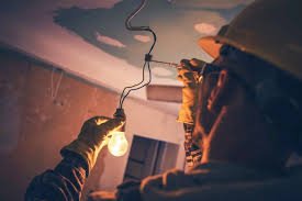 electricial pulling old wire out ceiling